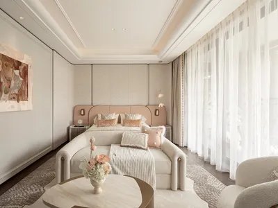Modern luxury bedroom with blush pink upholstered bed, cream boucle sofa, marble coffee table, abstract wall art, and sheer white curtains allowing soft daylight.