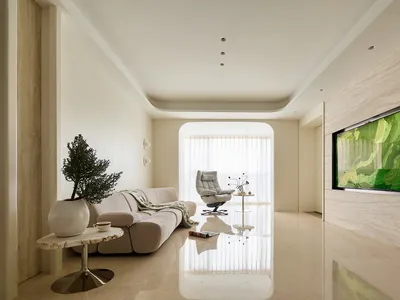 Modern minimalist living room featuring travertine marble walls, a cream modular sofa, a white recliner, and a large green abstract landscape artwork on the right wall.