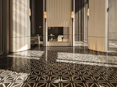 Luxurious hotel lobby featuring a tall central fireplace with lit fire, dramatic floor-to-ceiling curtains, and a polished black marble floor with white geometric pattern.
