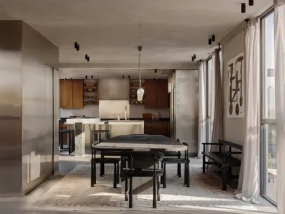 現代簡約風格餐廳，設有大型深色木質餐桌與同系列椅組、大理石廚房中島、混凝土牆面與天花板、木質櫥櫃，以及一幅大型抽象畫作。