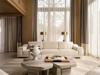 Modern minimalist living room with double-height curved ceiling, off-white bouclé sofa, travertine coffee tables, and floor-to-ceiling sheer curtains allowing natural daylight.