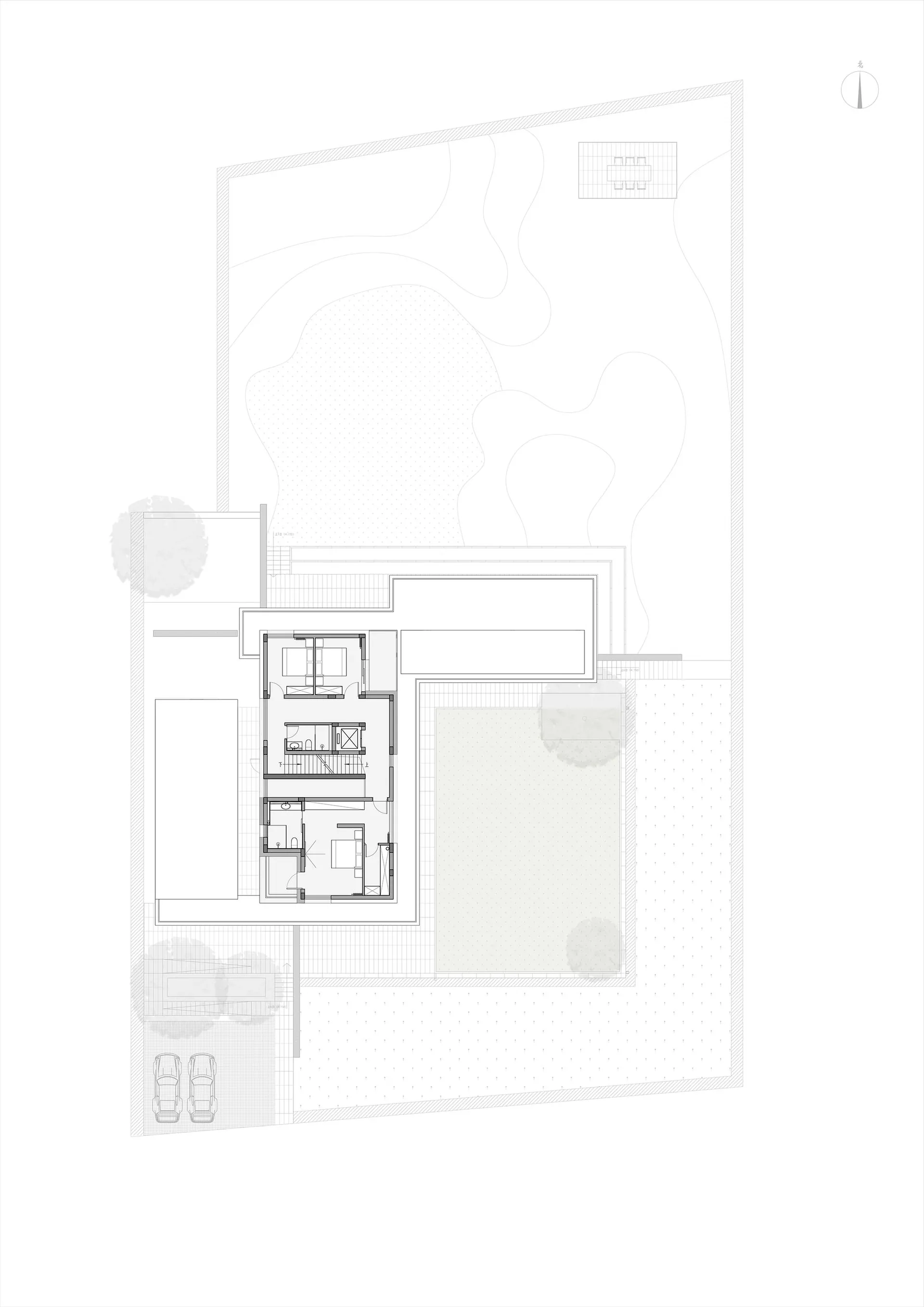 Floor plan of a minimalist residential house featuring concrete and glass materials.