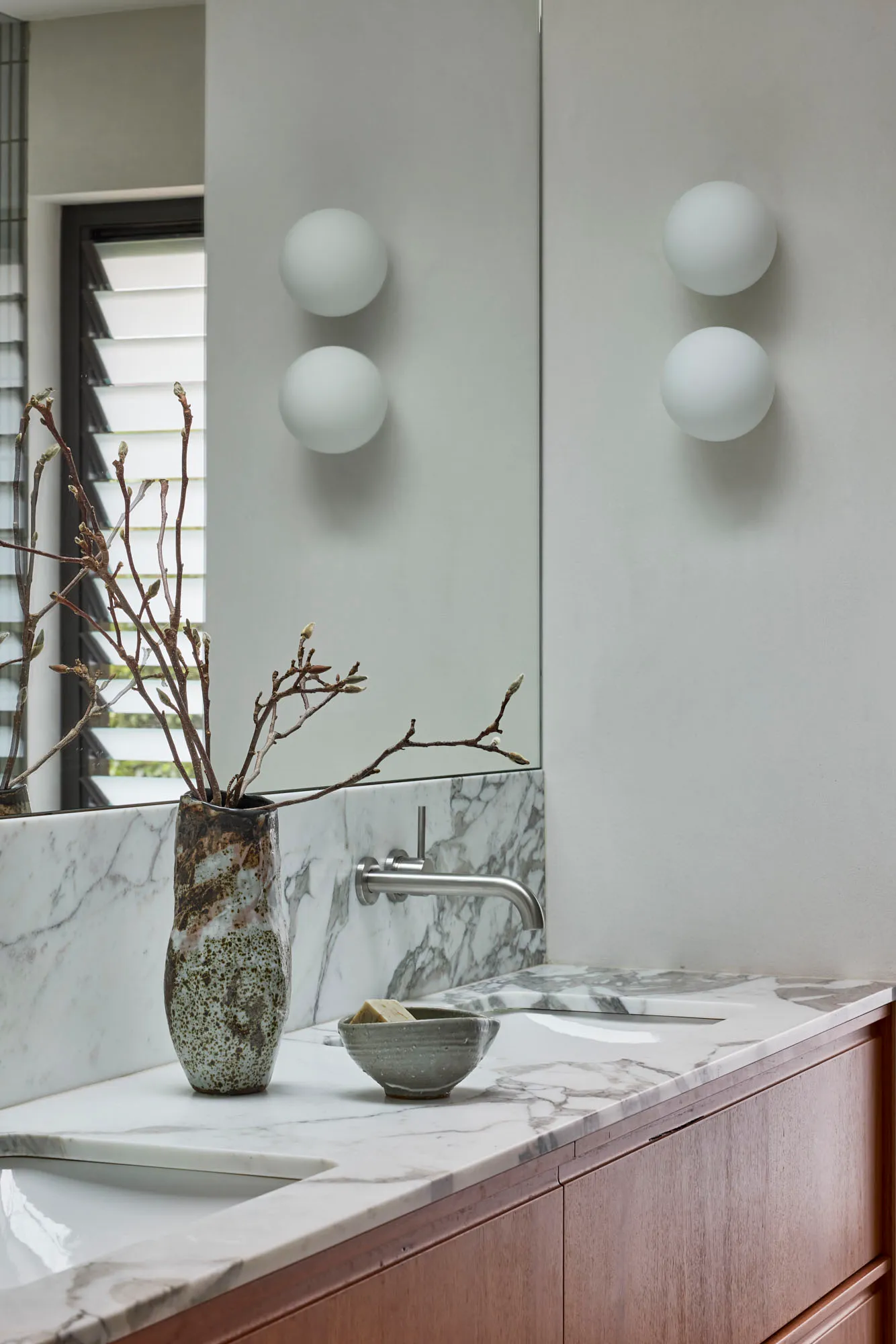 Modern minimalist marble bathroom with minimalist design and white marble countertop, showcasing sleek, contemporary style an