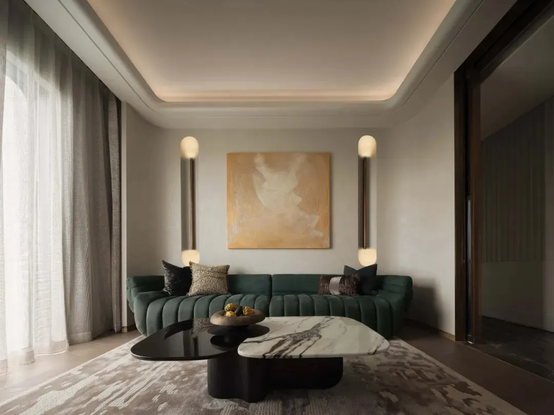 Modern living room with green vinyl sofa, marble coffee table, and abstract painting
