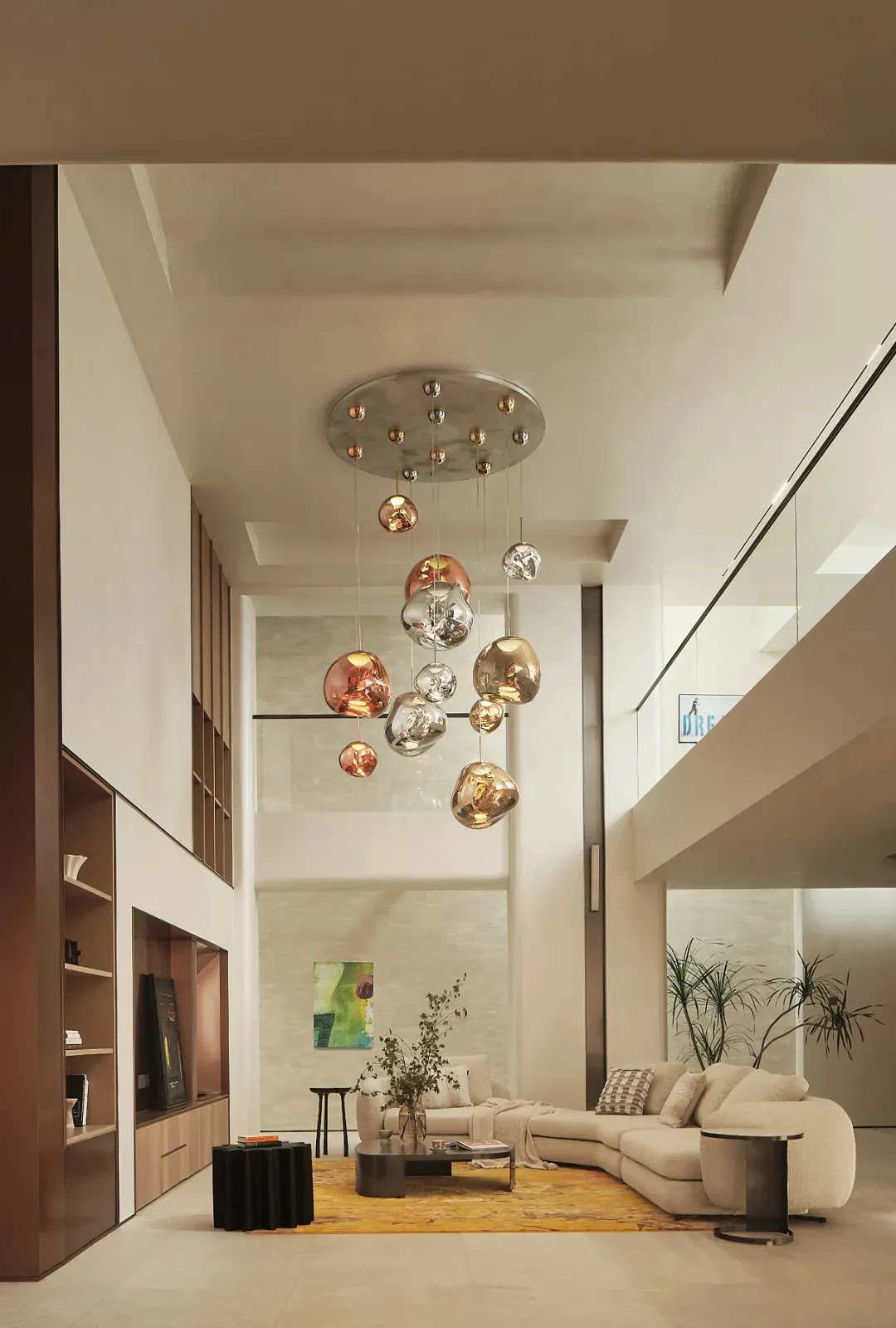 Contemporary living room featuring a modern glass and metal chandelier.