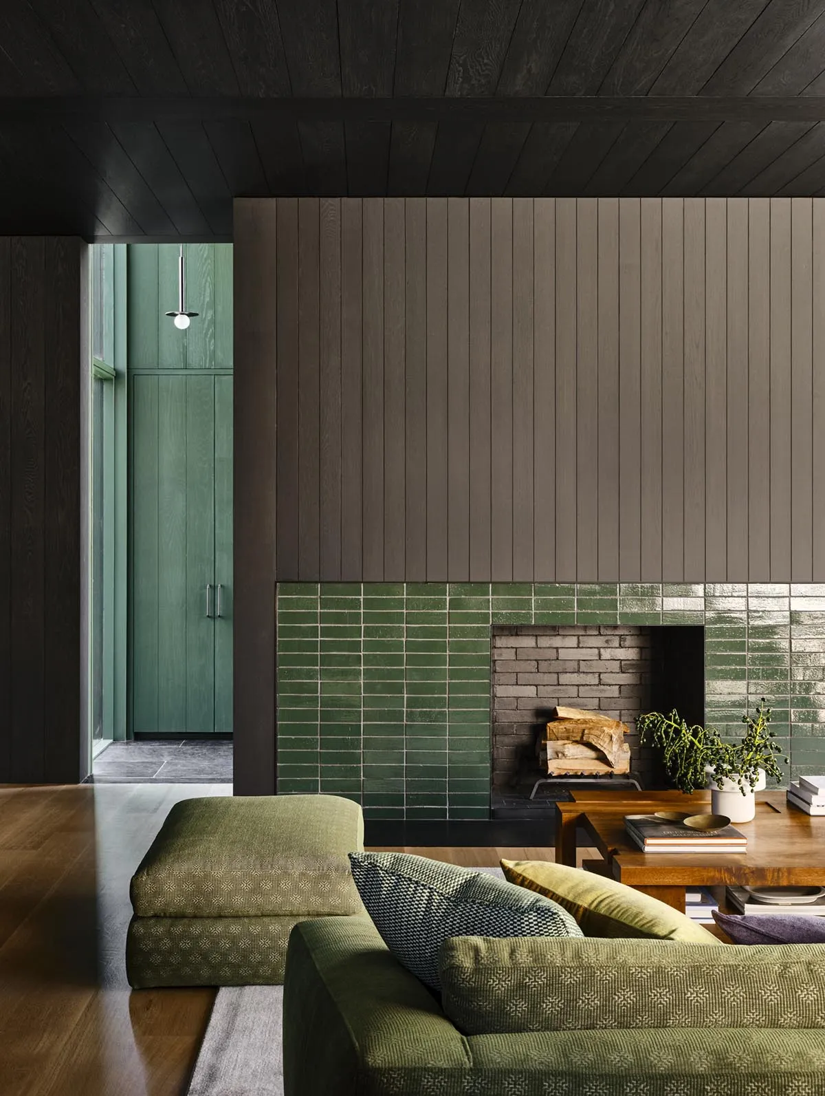 Modern living room featuring a tiled fireplace and wooden accents.