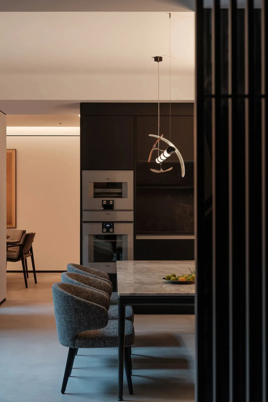Modern minimalist dining room with marble table and chairs