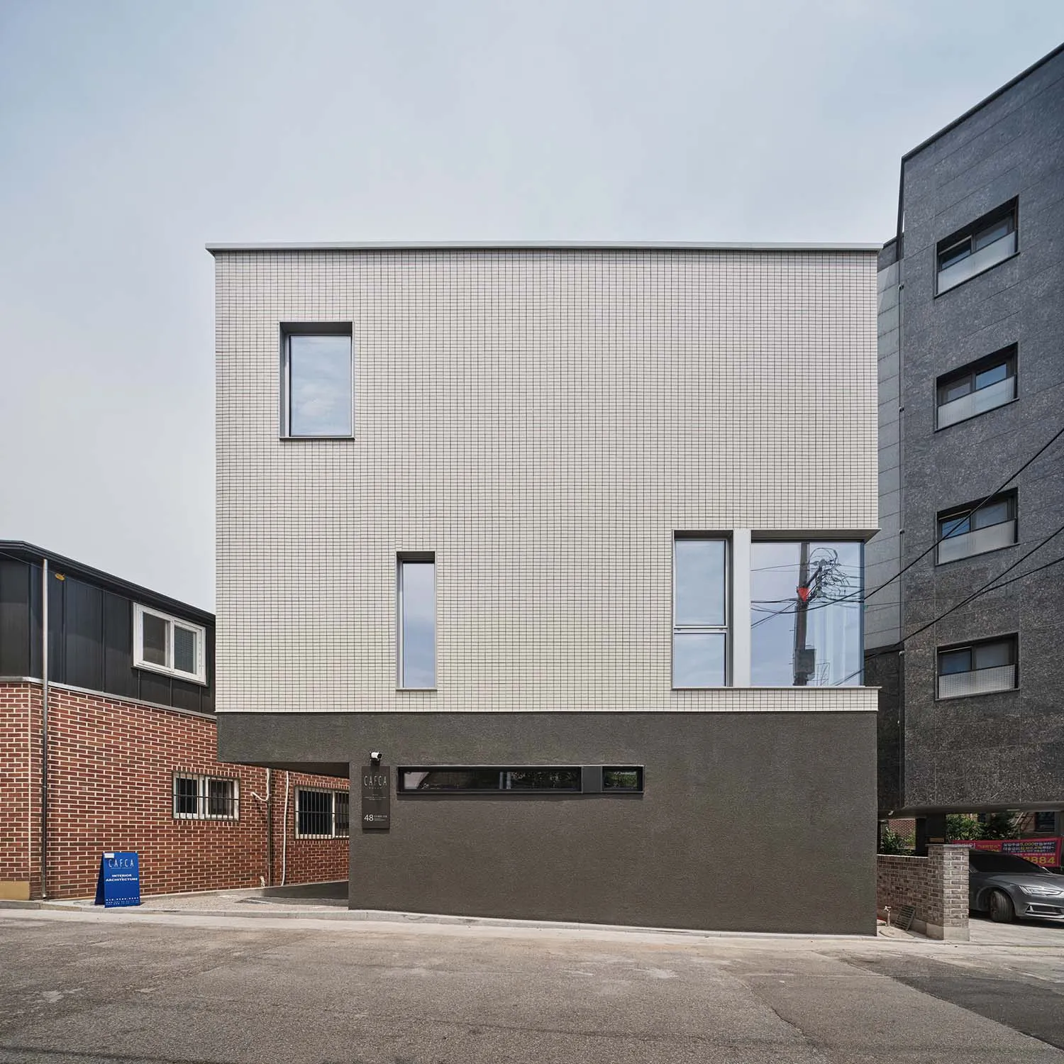 Modern house with tiled and concrete facade