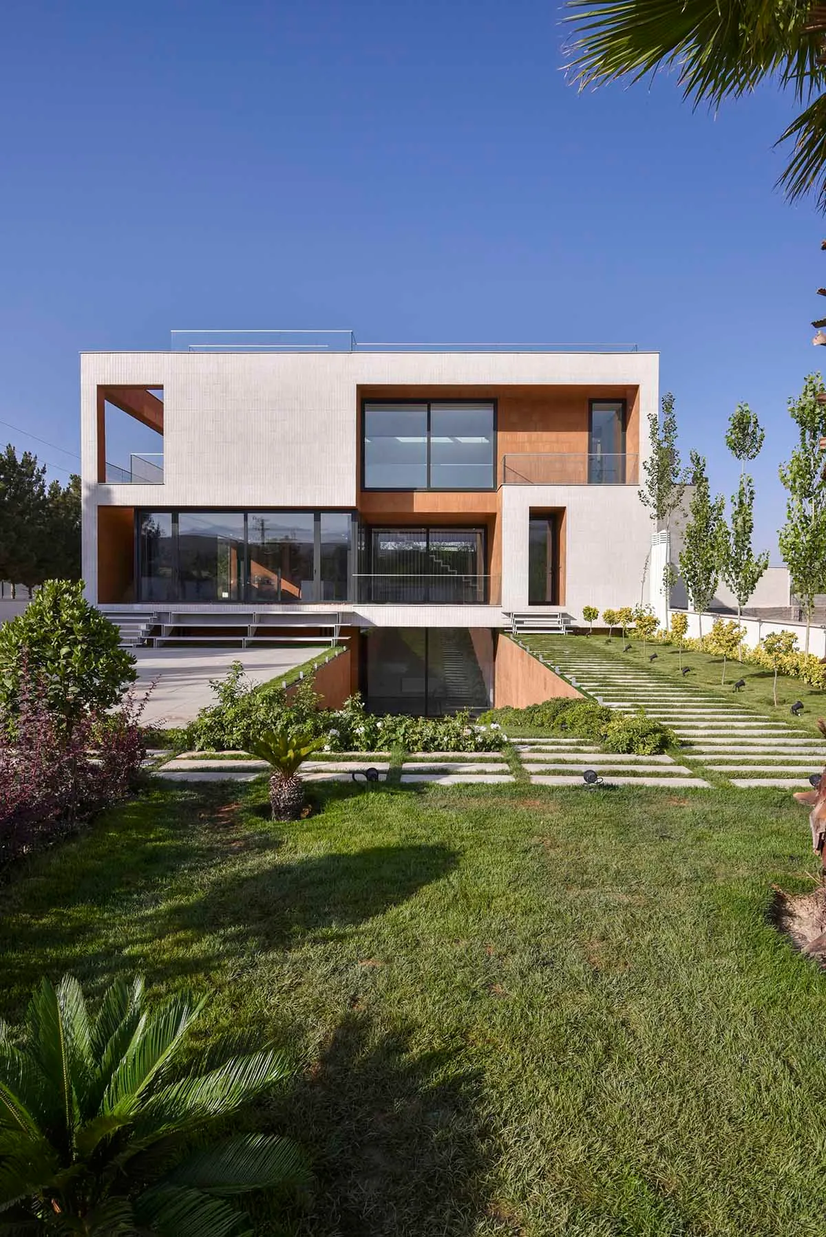 A modern house exterior with concrete and glass materials.