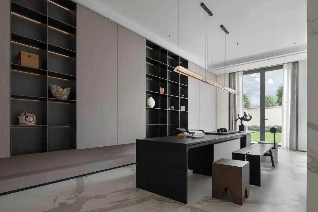 Modern minimalist office space with white and black color palette and floor-to-ceiling windows.