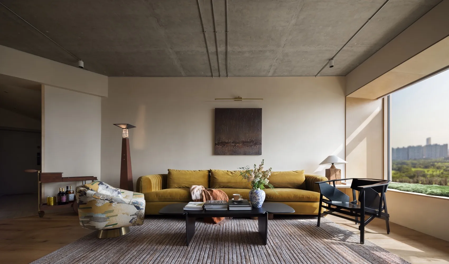 Modern living room featuring concrete, wood, and glass materials.