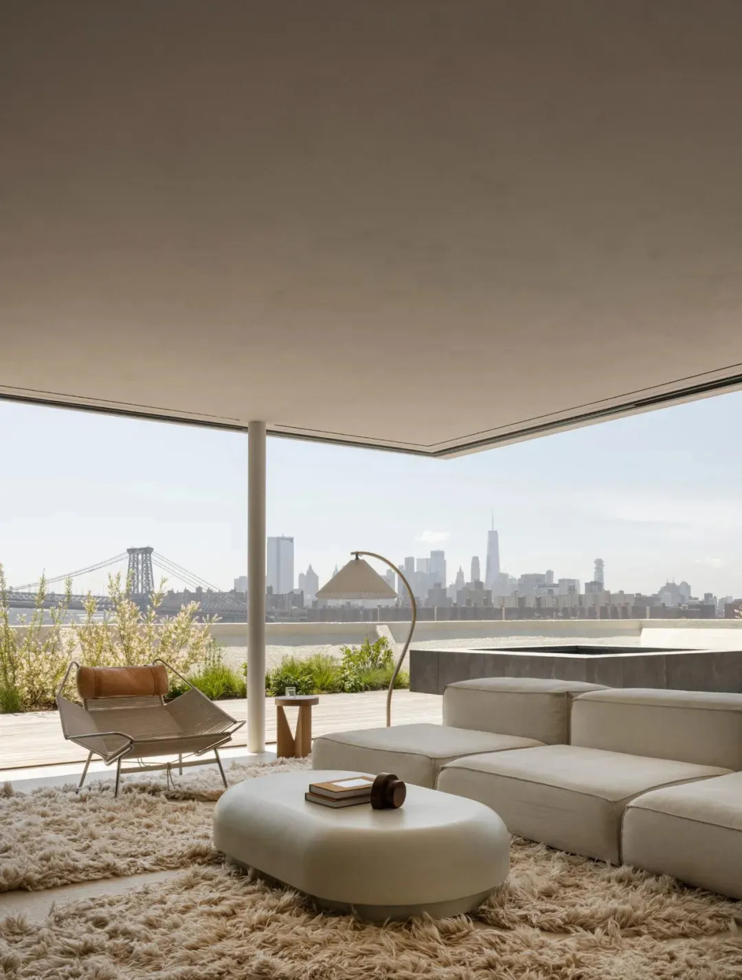 White and beige modern living room with panoramic city view.