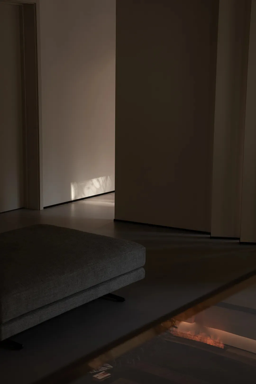 A modern living room with neutral fabrics and minimalist design.
