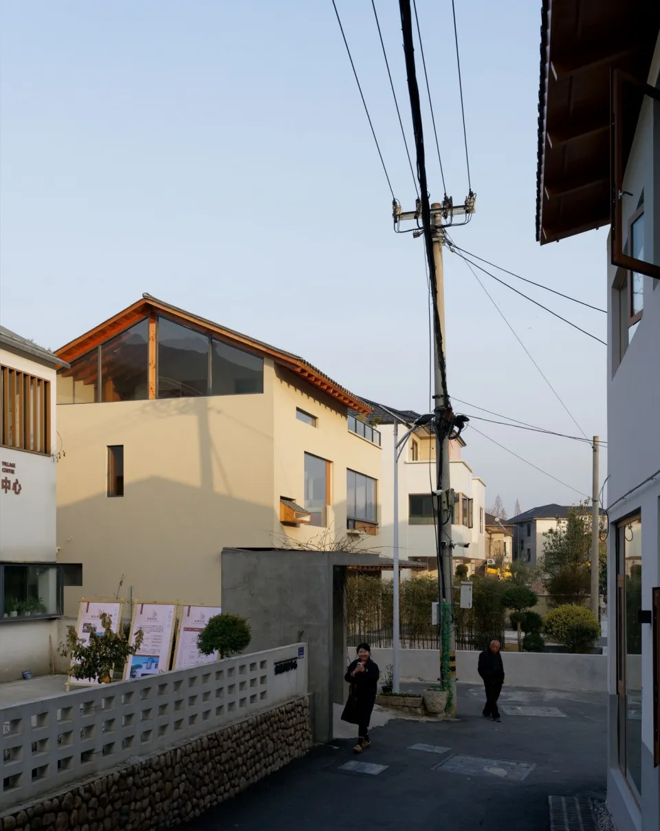 Modern residential neighborhood with concrete, glass, and wood exteriors.