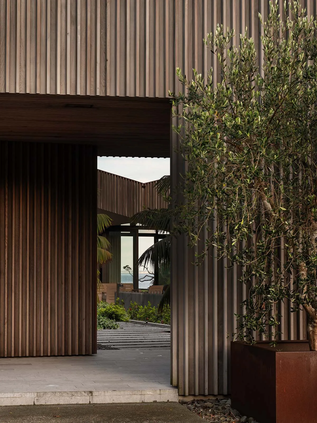 An architectural exterior featuring modern design elements and timber siding.