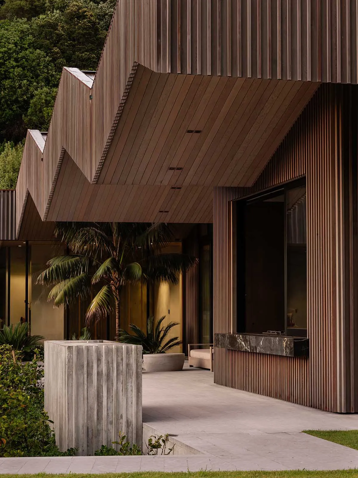 A modern building exterior featuring wooden panels