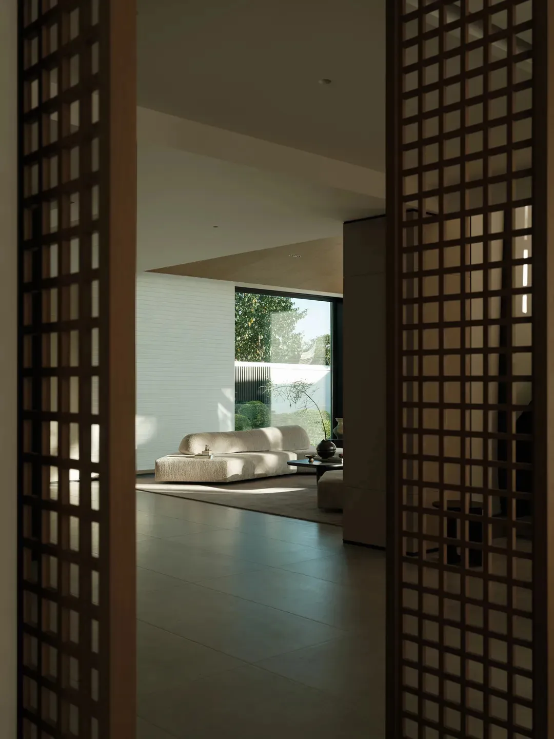 A modern interior living space with concrete walls and floor.