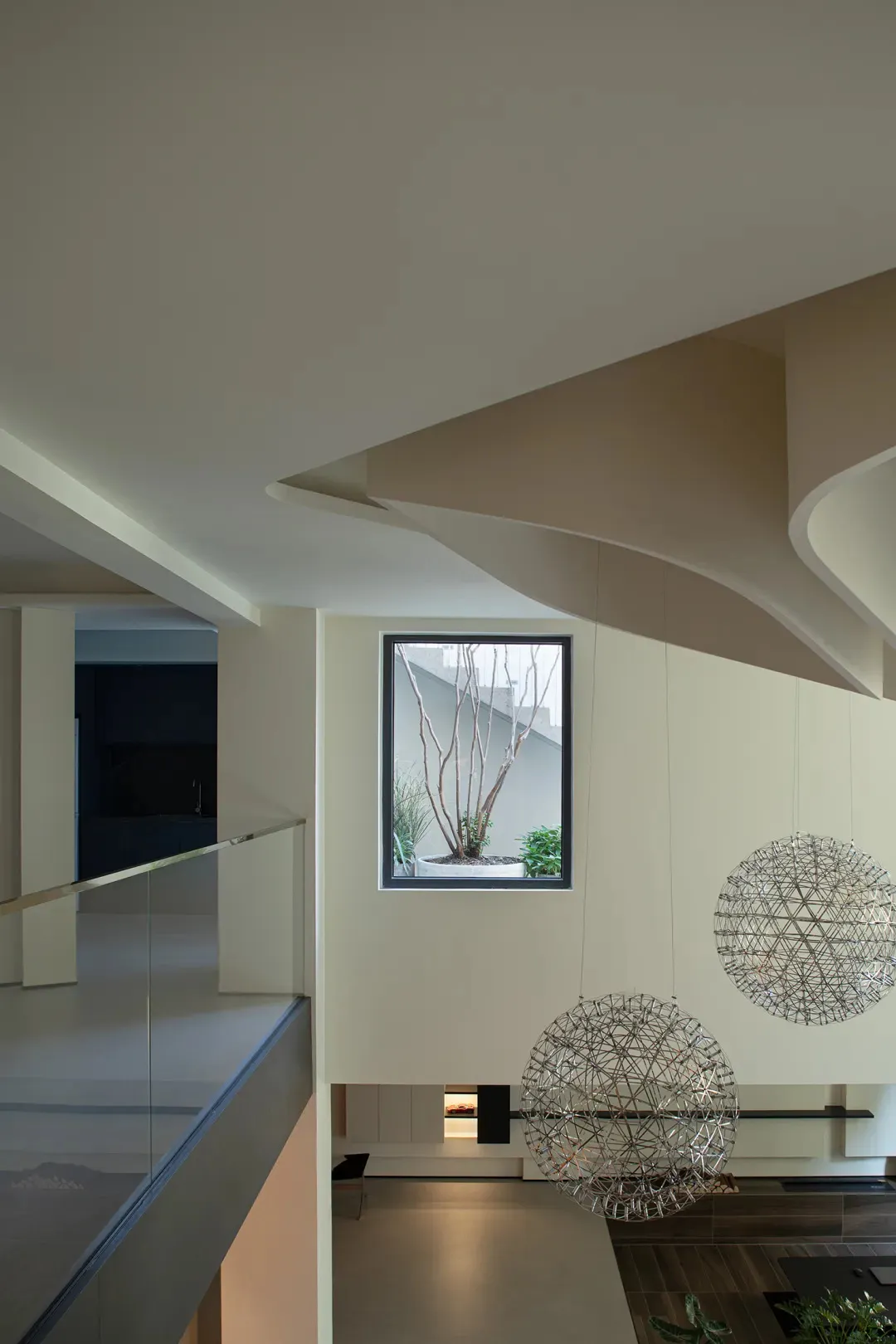 Modern interior with concrete and glass, featuring sleek lines and a contemporary design.