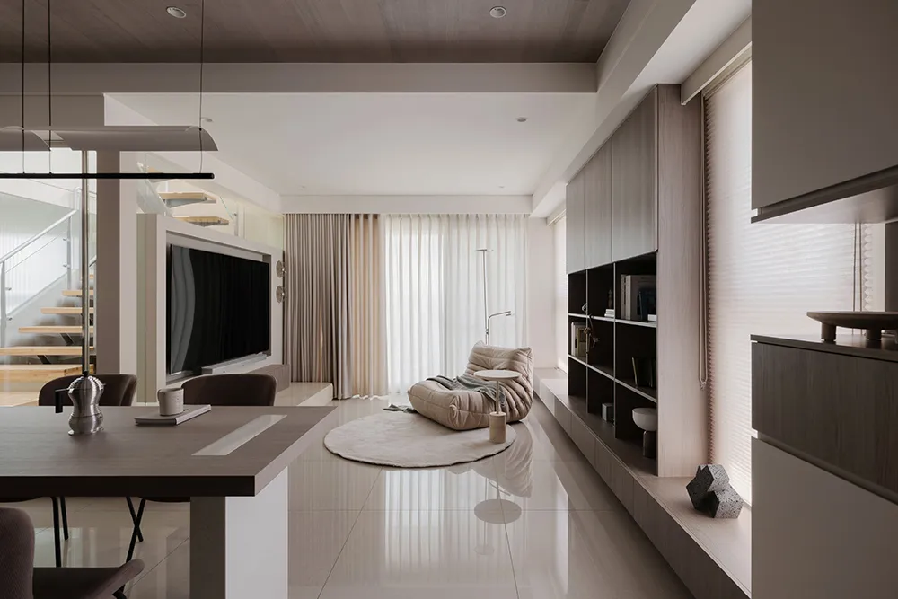 Minimalist living room featuring wood and marble materials.