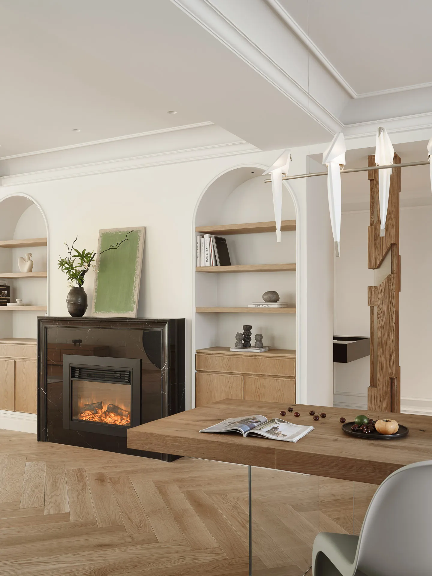 Modern living room with a fireplace, wooden table, and marble shelving unit.