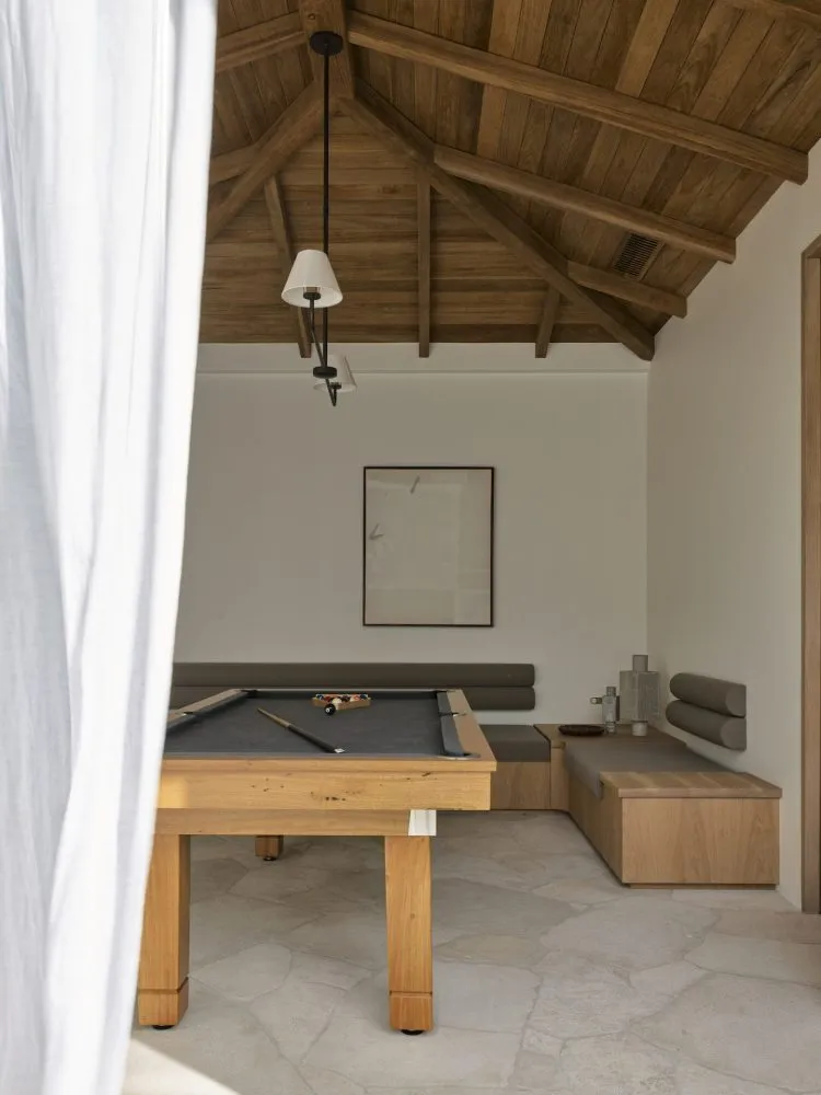 Modern living room featuring a wooden ceiling, wooden flooring, and a comfortable seating area with a wooden sofa and a woode