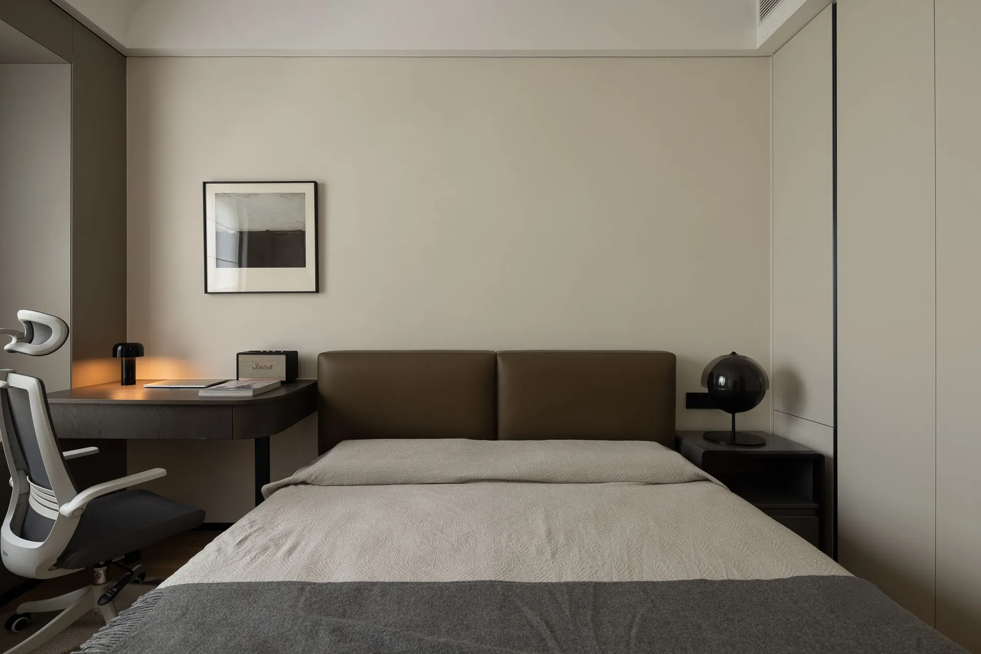 Modern bedroom with sleek, contemporary design features minimalist furniture and high-quality materials.