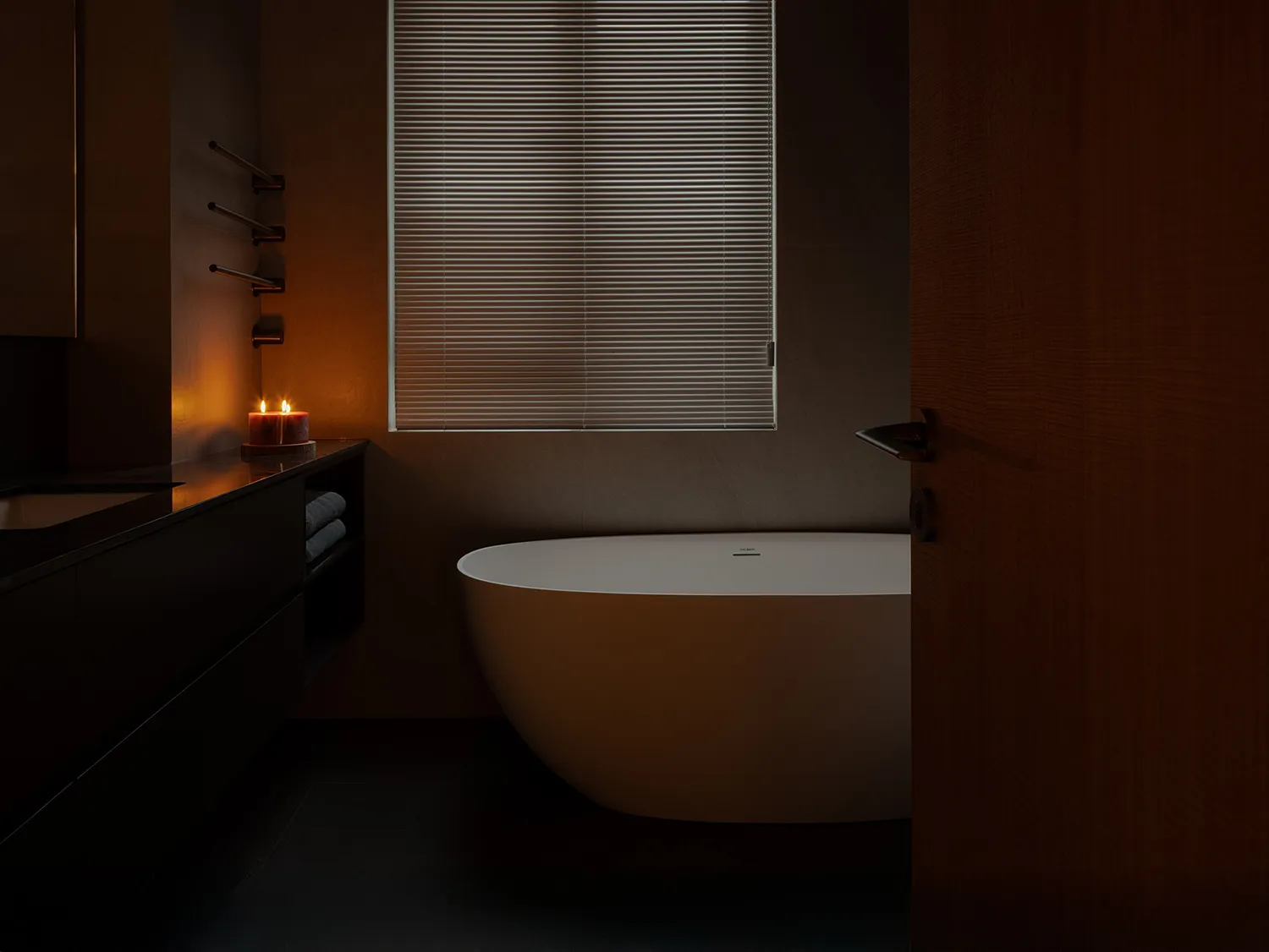 A modern bathroom featuring industrial elements with a focus on minimalist design and industrial touches, including a freesta
