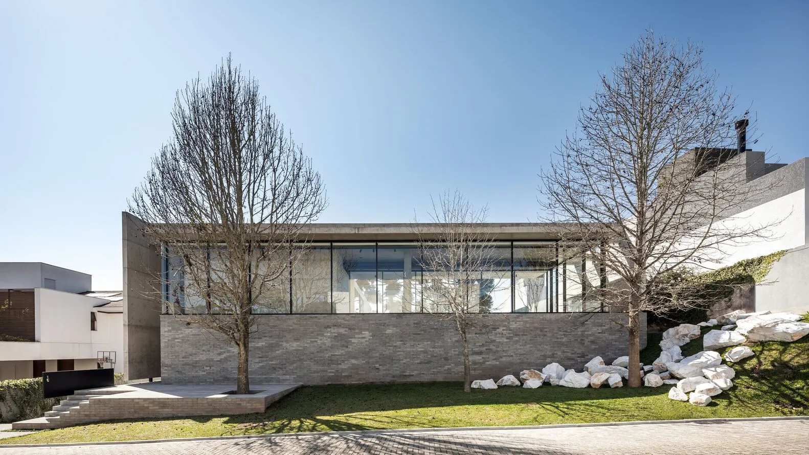 Modern house exterior with concrete walls and minimalist design.