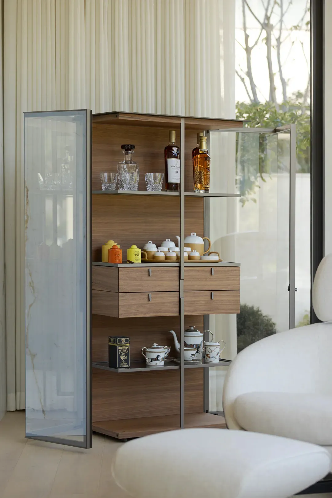A modern display cabinet made of wood and glass.