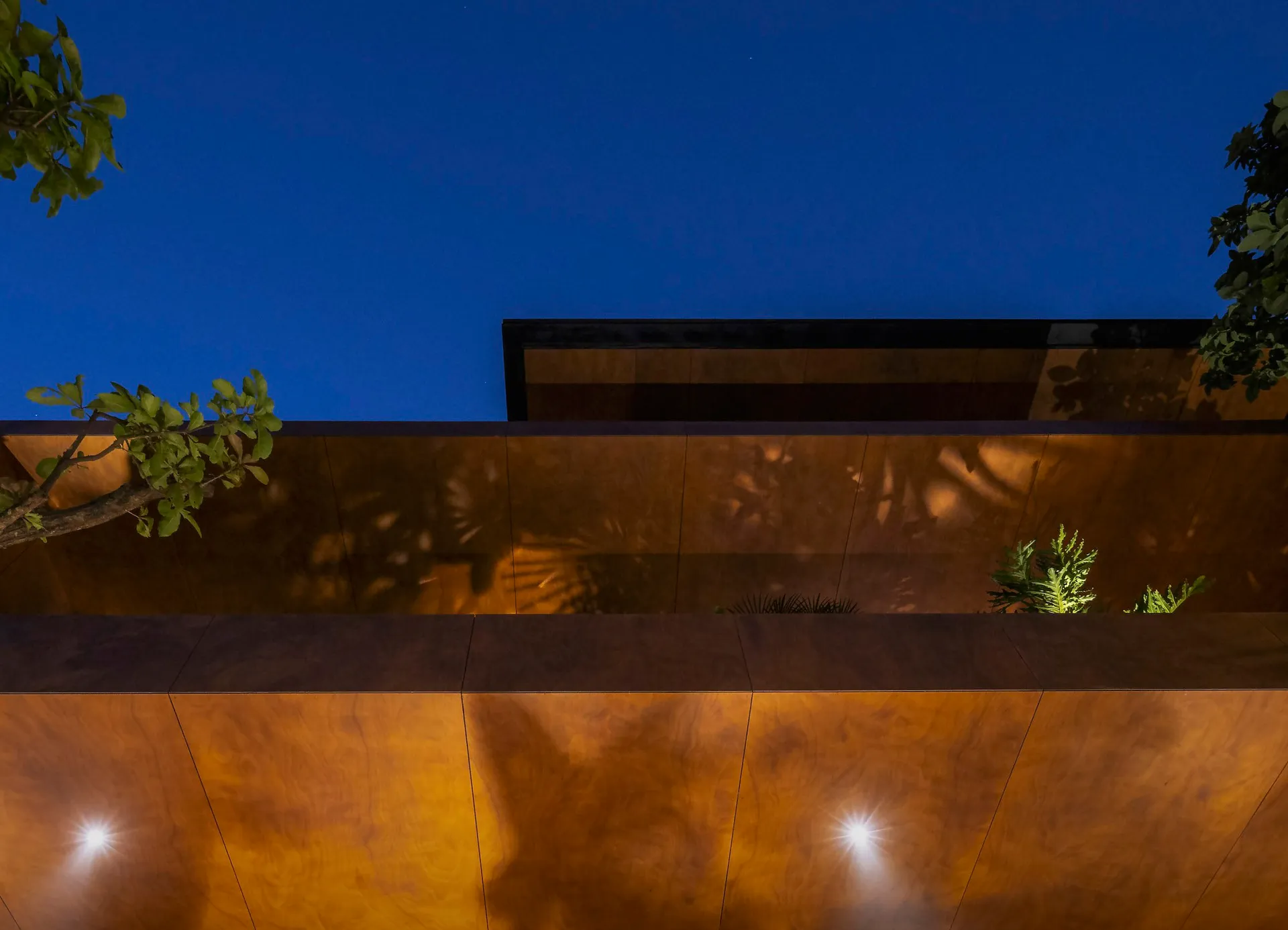 Modern metal wall exterior at night