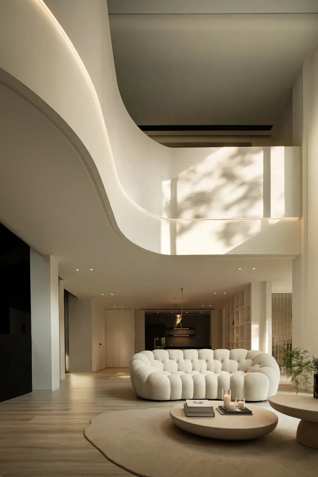 Modern living room featuring a plush sofa with soft, light-fabric upholstery, complemented by warm, ambient lighting and mini