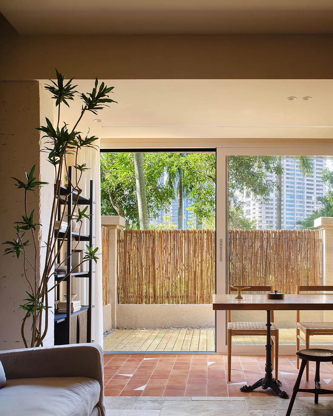 Modern interior design featuring a bamboo fence and natural materials.