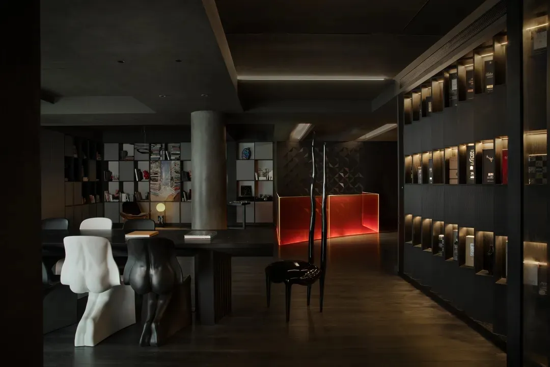 A modern wine bar featuring contemporary design elements such as concrete and glass.