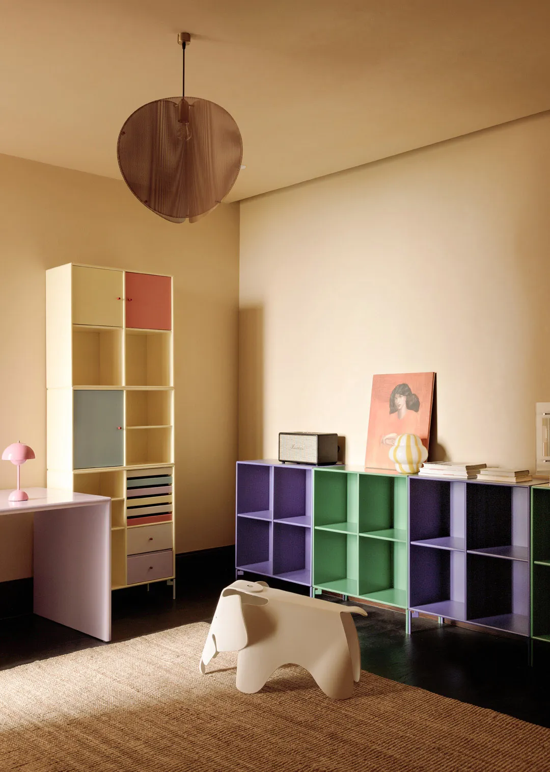 Modern living room featuring colorful shelving units and a minimalist design.