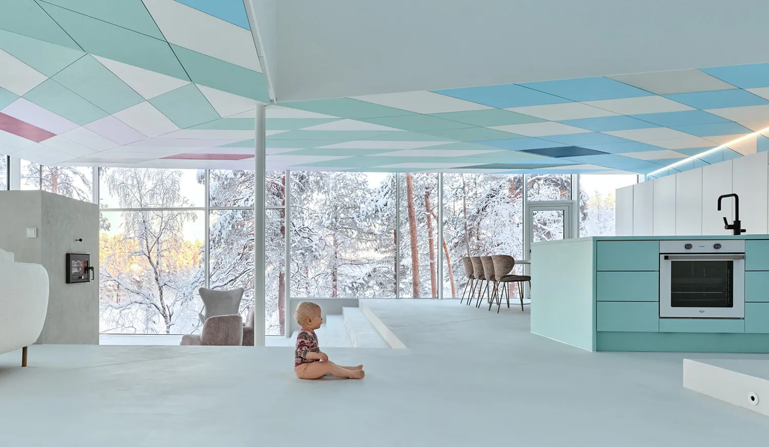 Modern, minimalist interior design featuring a white floor and blue geometric ceiling tiles.