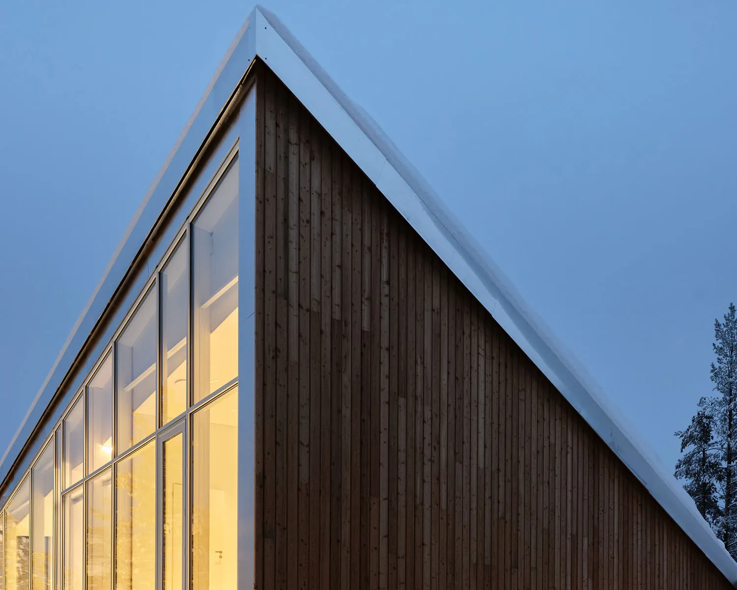 Image of a modern office building exterior with wood siding and large windows.