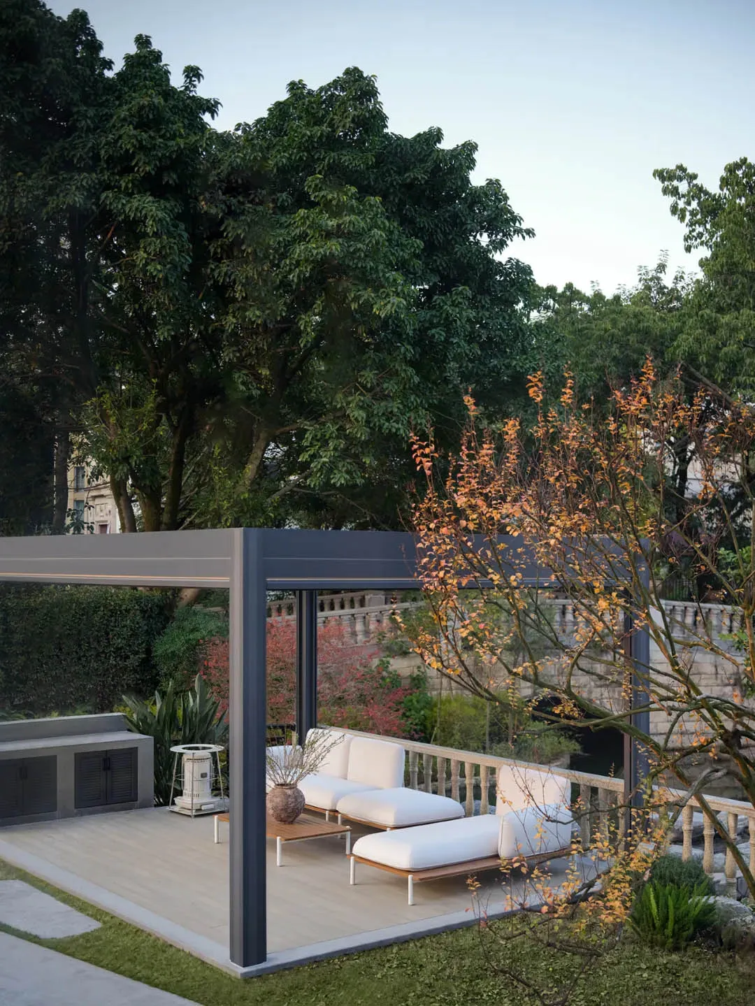 An outdoor living area with modern metal structures and white cushions on a deck.