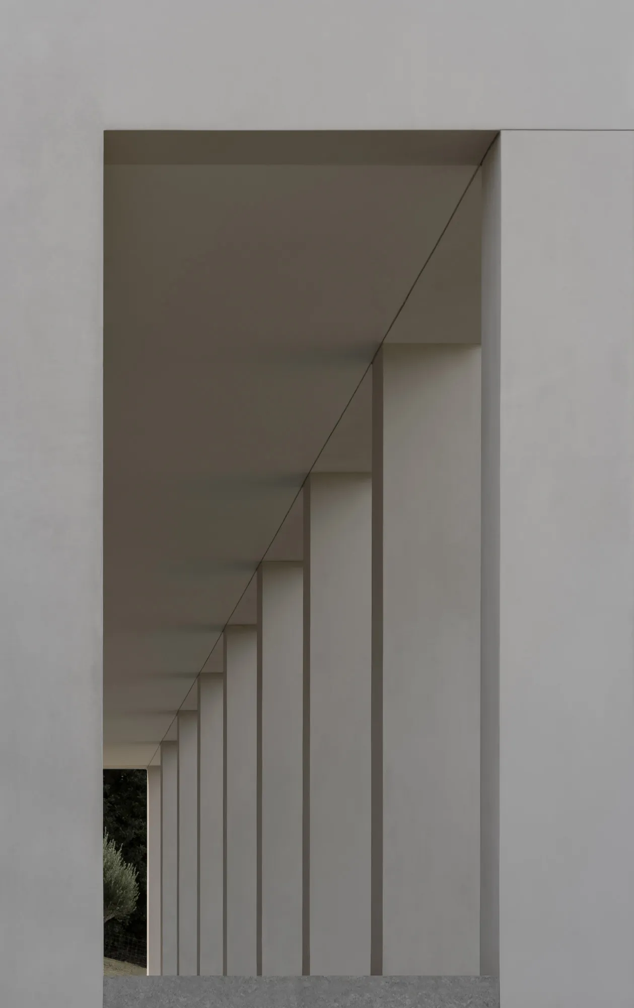 A modern architectural design featuring concrete columns and ceiling lights.