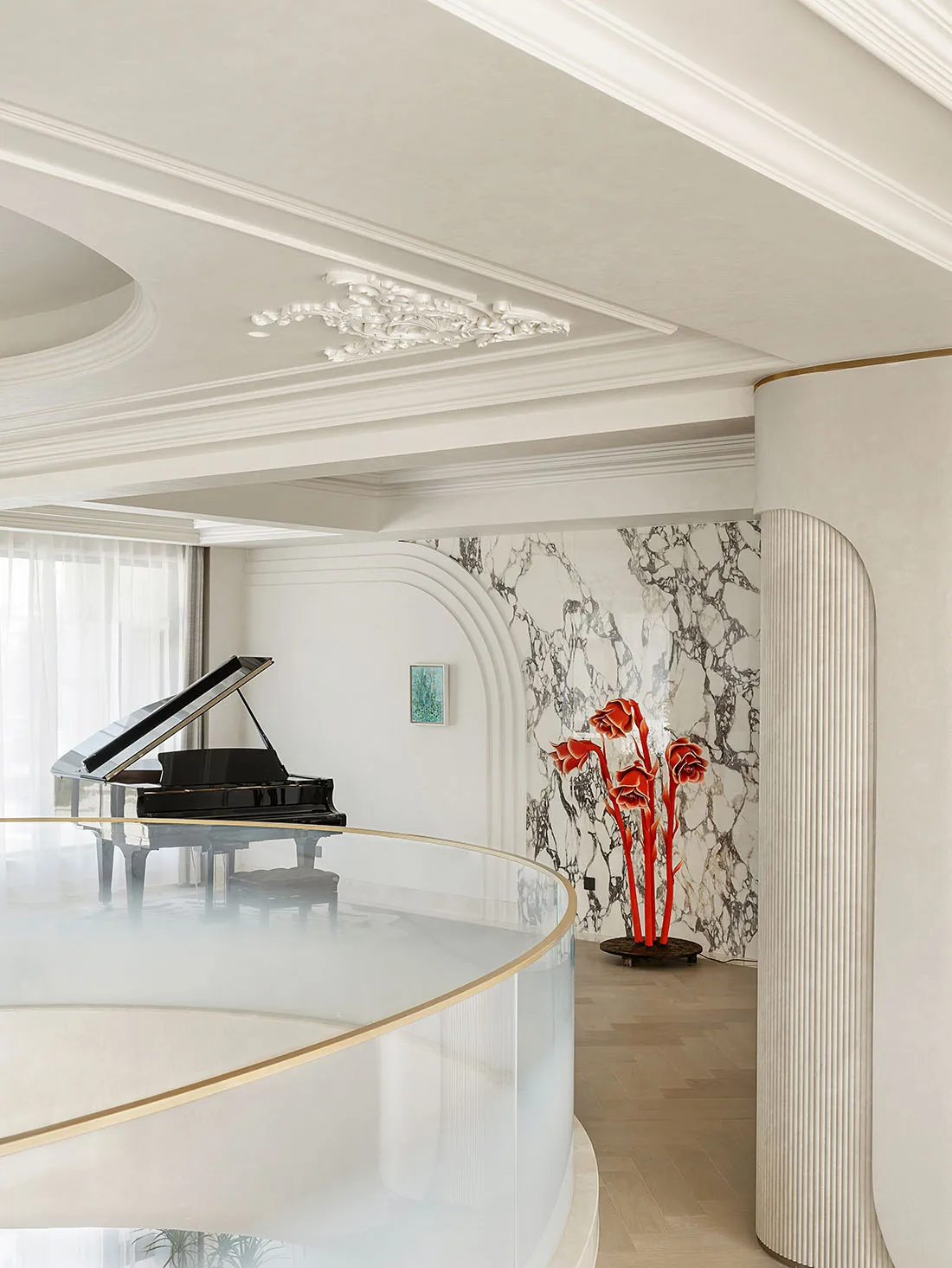 Modern apartment featuring a stylish living area with marble surfaces and a grand piano.