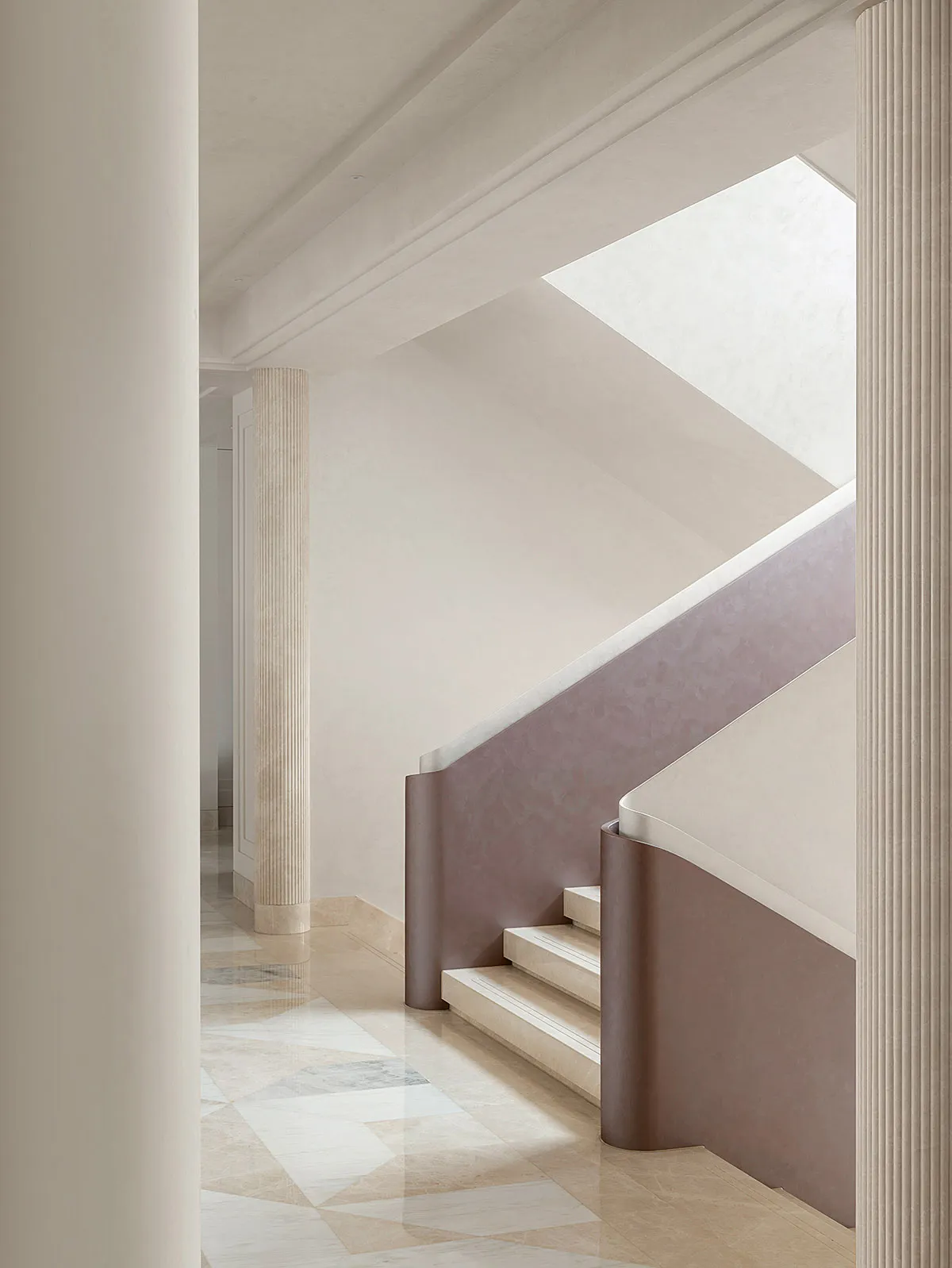 Modern staircase with marble walls and floors.