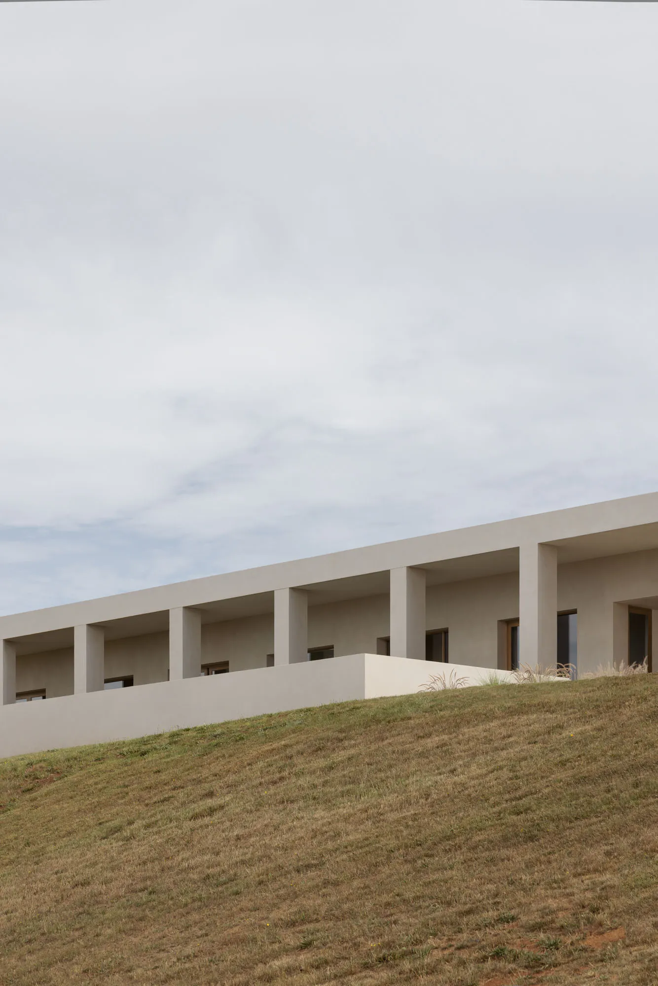 A modern architectural structure with a minimalist design, constructed of concrete.
