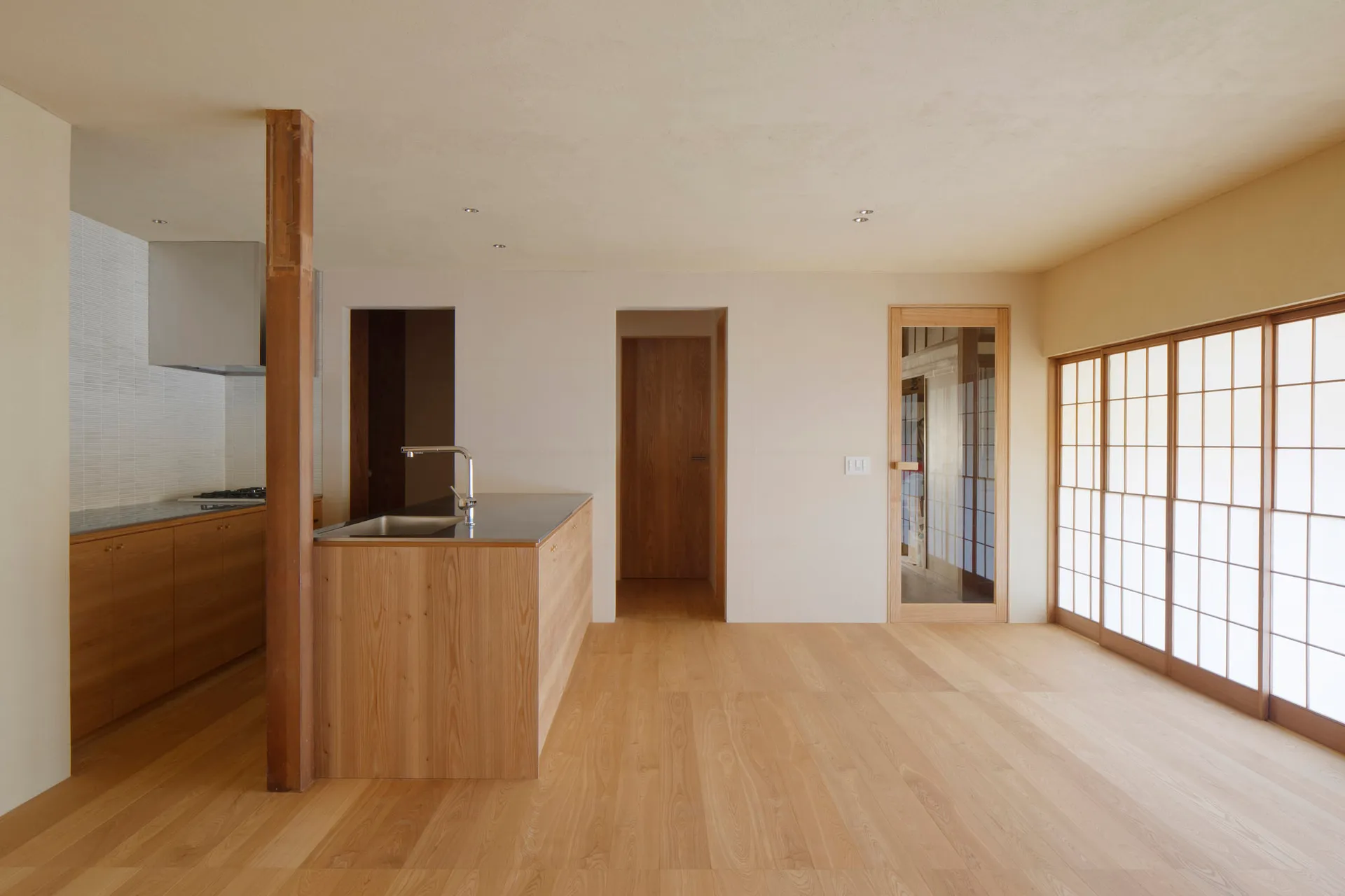 A modern residential interior featuring wood and concrete materials.