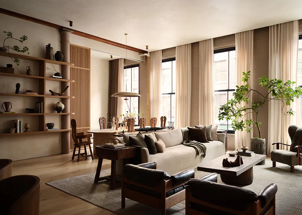 A cozy living room with comfortable furniture, wood accents, and soft textiles.