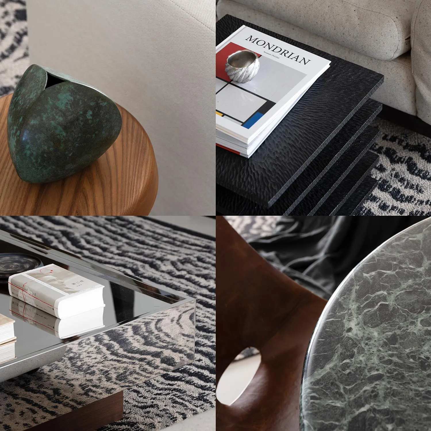 A modern interior coffee table with a metallic vase, books, and marble material.