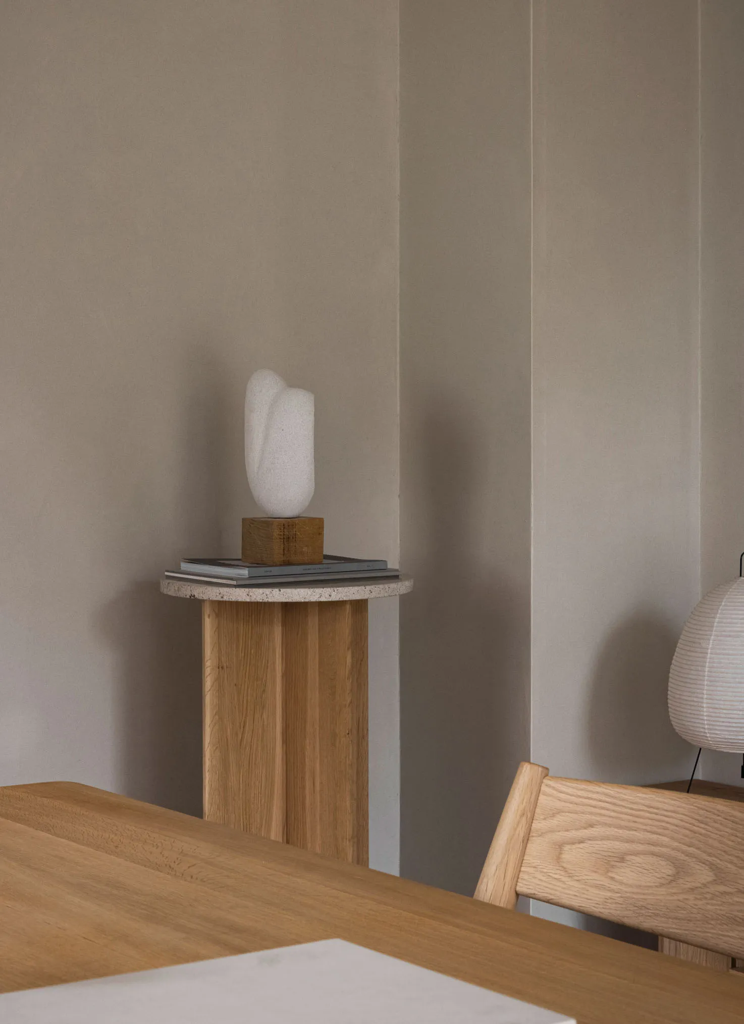 Modern interior design featuring a wooden stool with a minimalist design.