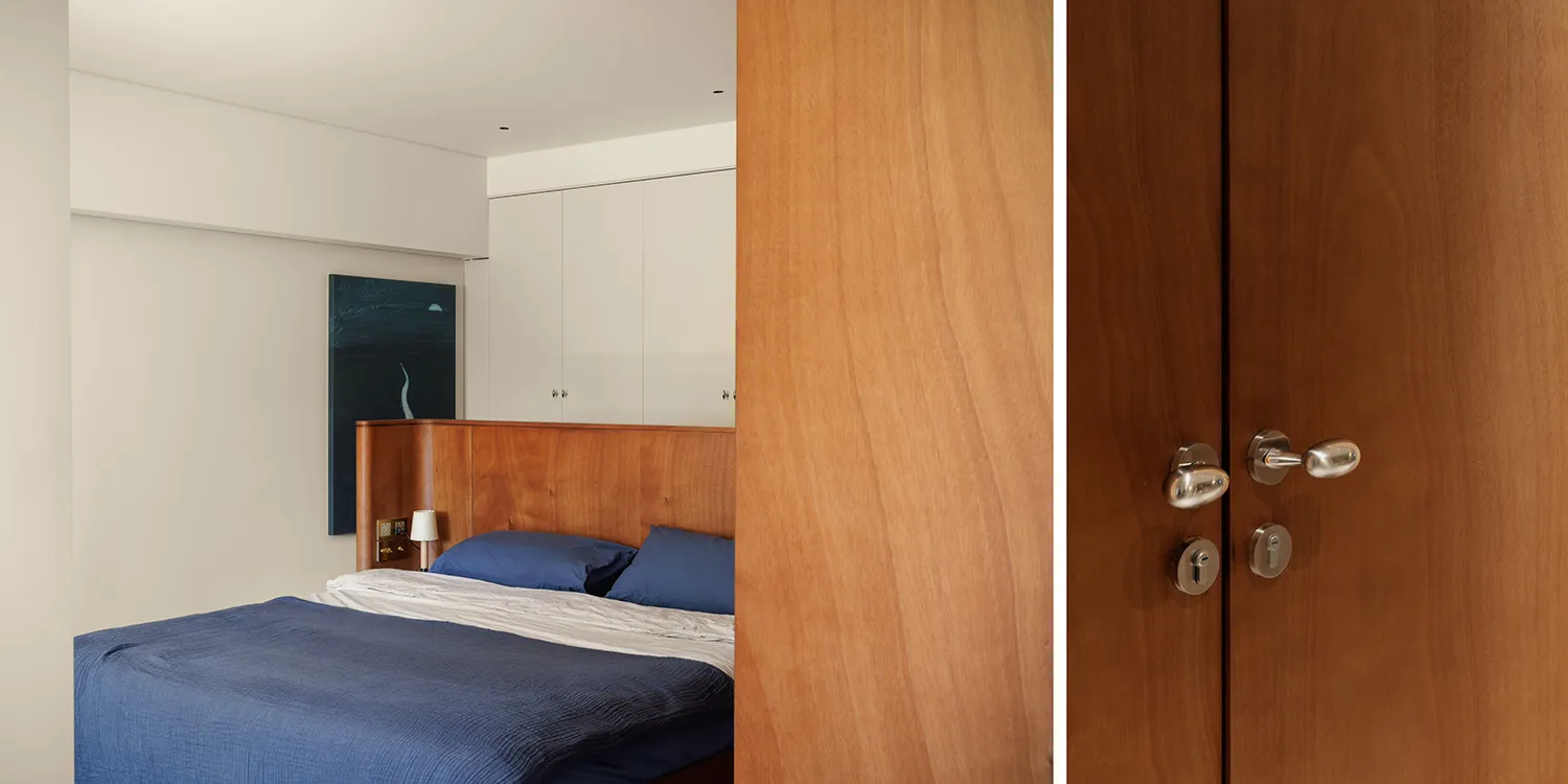 Modern minimalist bedroom featuring wooden furniture and cabinets.