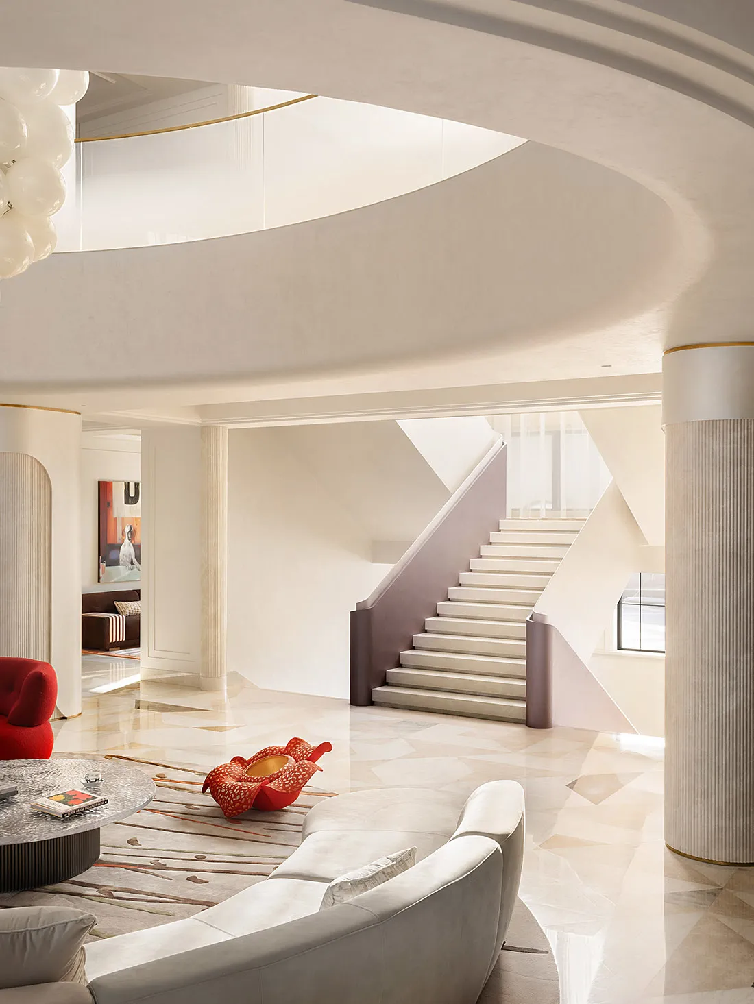 A modern residential interior featuring a marble staircase with sleek, curved lines and minimalistic design elements.