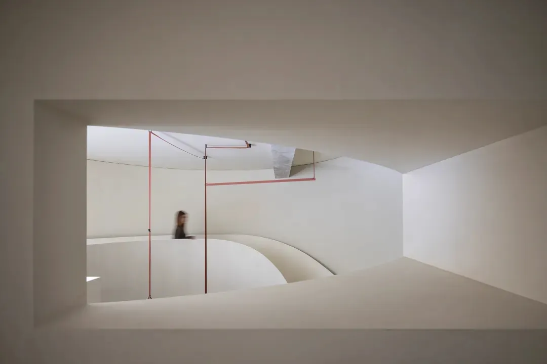 Modern staircase design with glass railings and a minimalist interior