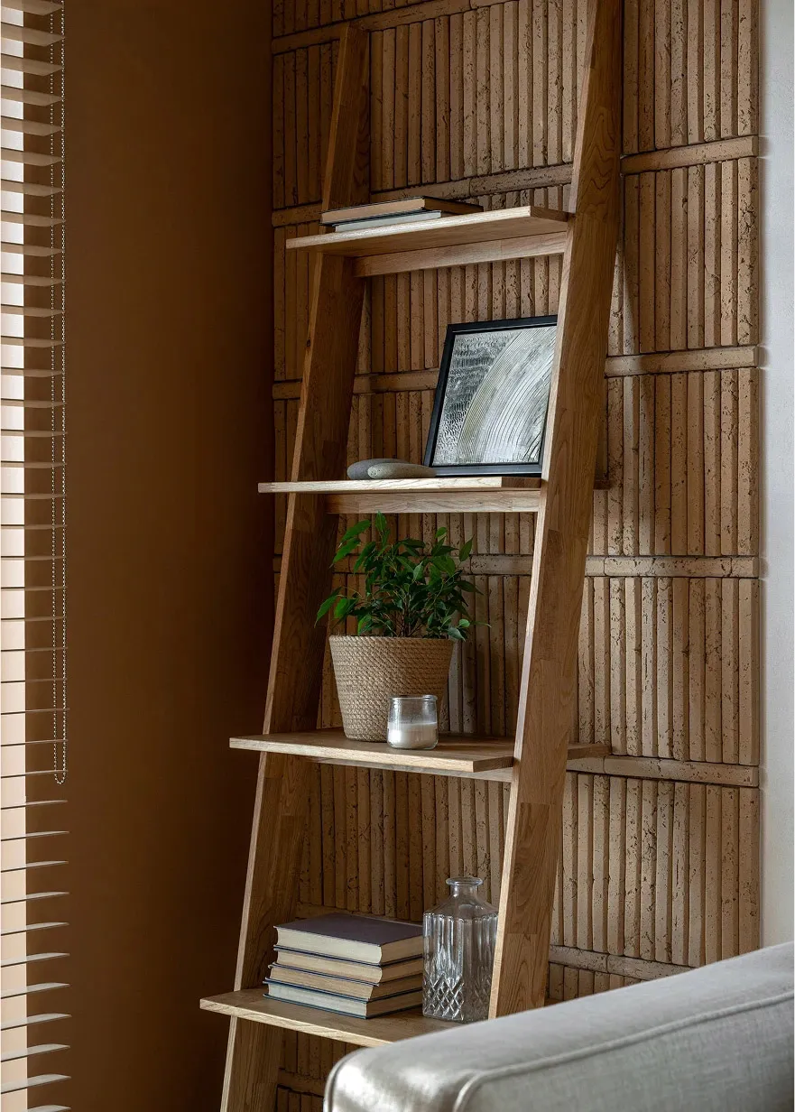 A modern interior design featuring wooden shelves, plants, and books.