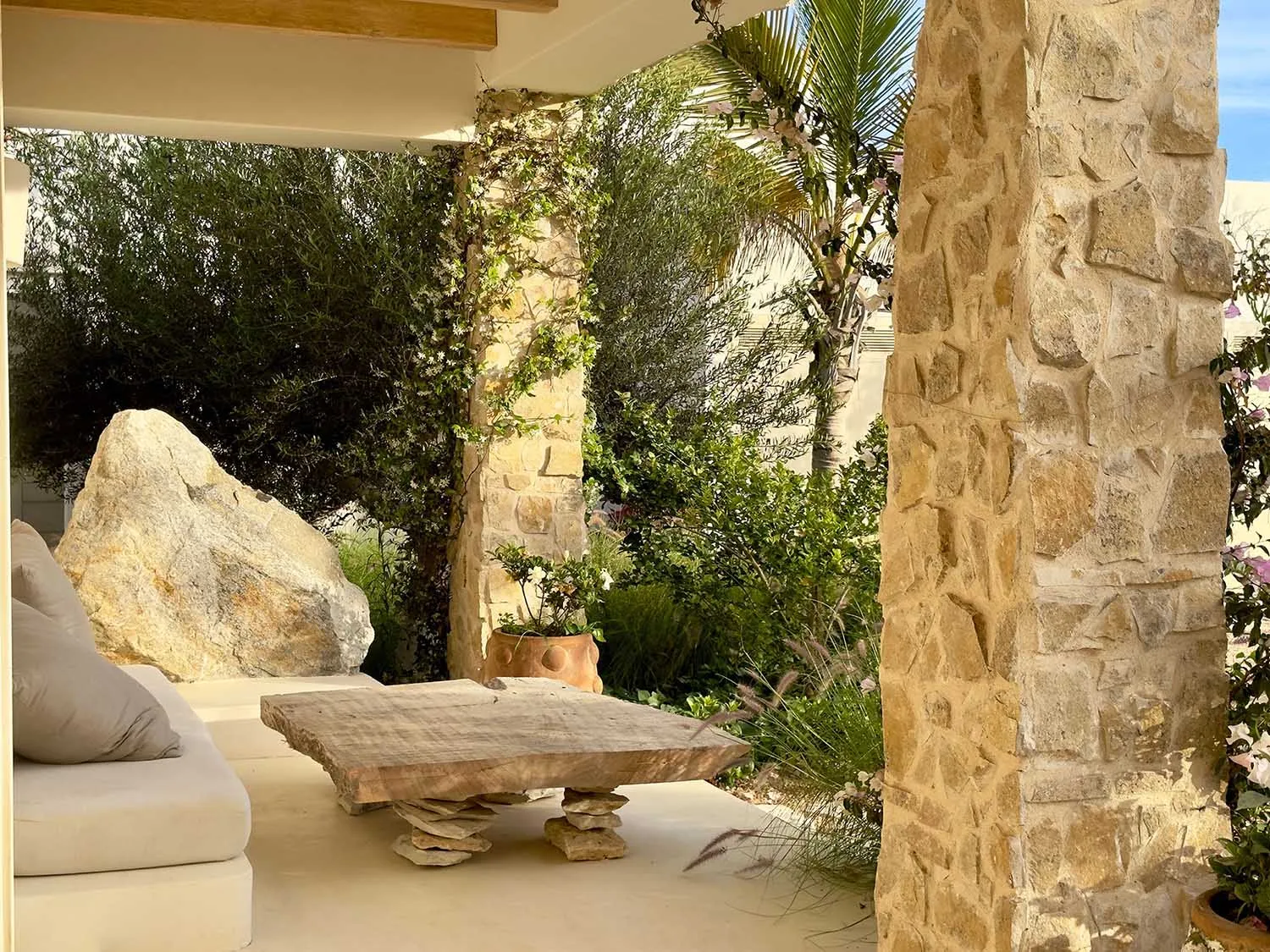 Modern living room extension featuring stone and concrete materials.